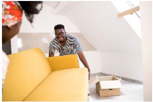 loading furniture into skip bin