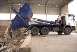 skip bin truck offloading mixed waste