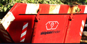 Close up of a red skip bin